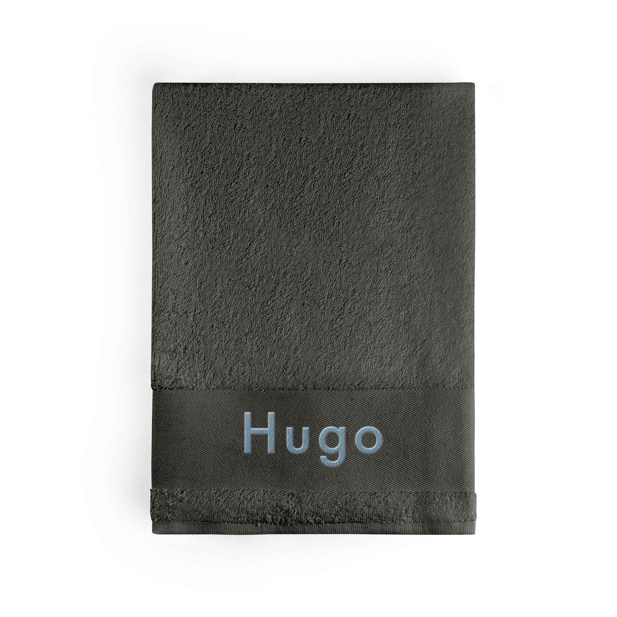 Serviette de bain anthracite personnalisée, brodée du prénom Hugo en bleu clair, pour créer un objet unique.