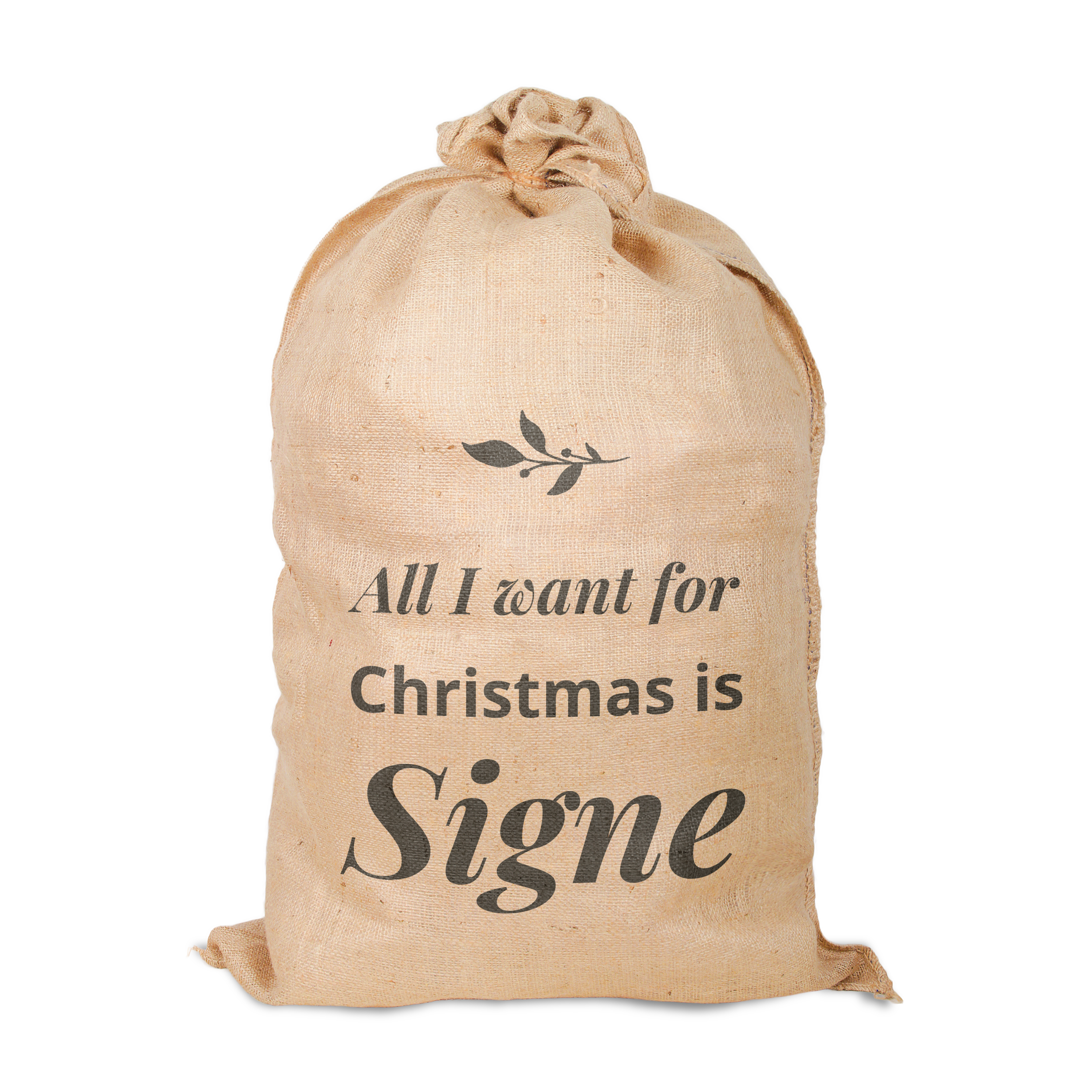 Jutsjulsäck i naturlig färg tryckt med designen All I want for Christmas is Signe och en kvist.