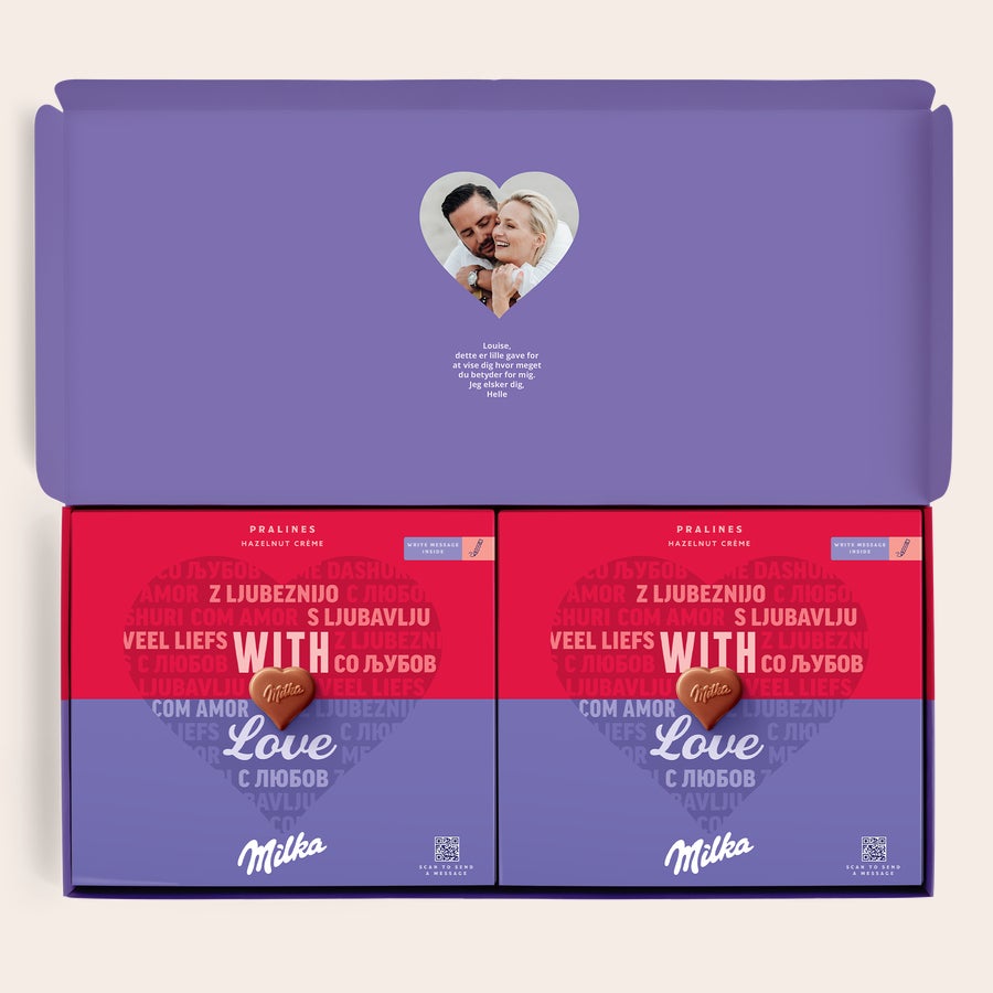 Milka Pralines Love Sig det med en Milka chokolade gaveæske med et billede af et par og personlig hilsen trykt på låget.