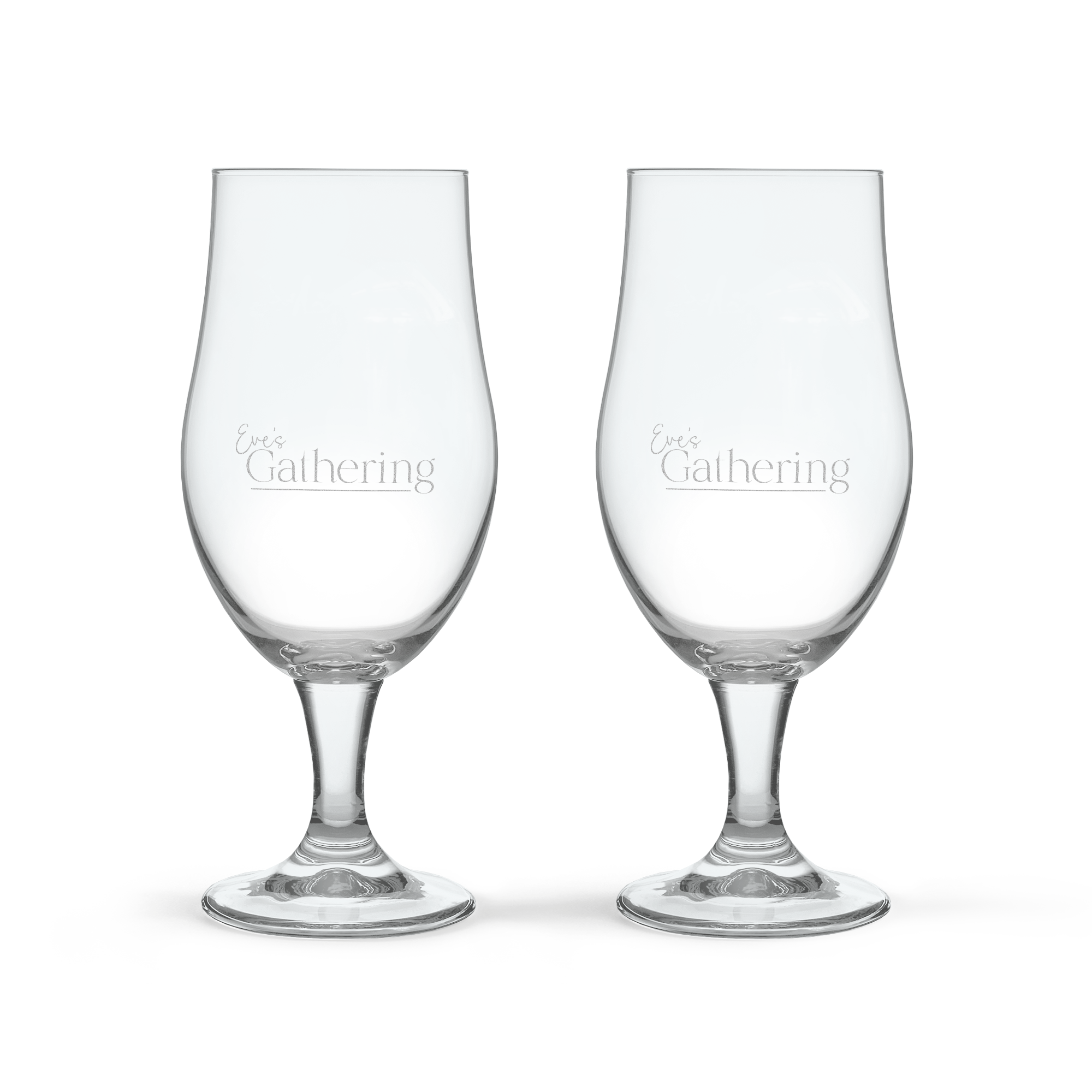 To graverte pina colada-glass i mørkt glass med teksten "Every Gathering" på hvert glass.