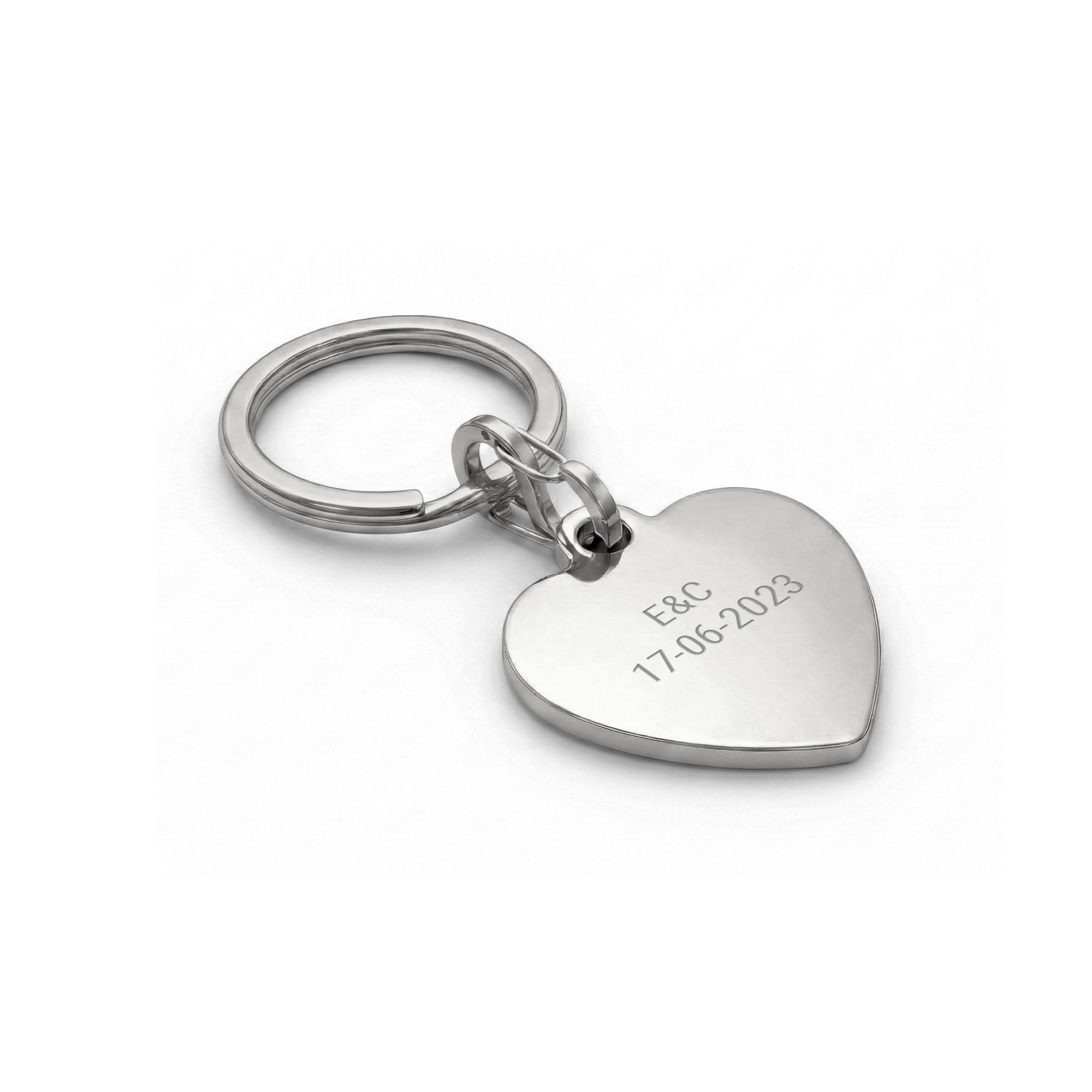 Engraved key ring Heart Silver with personalized E&C and 17-06-2023 text.