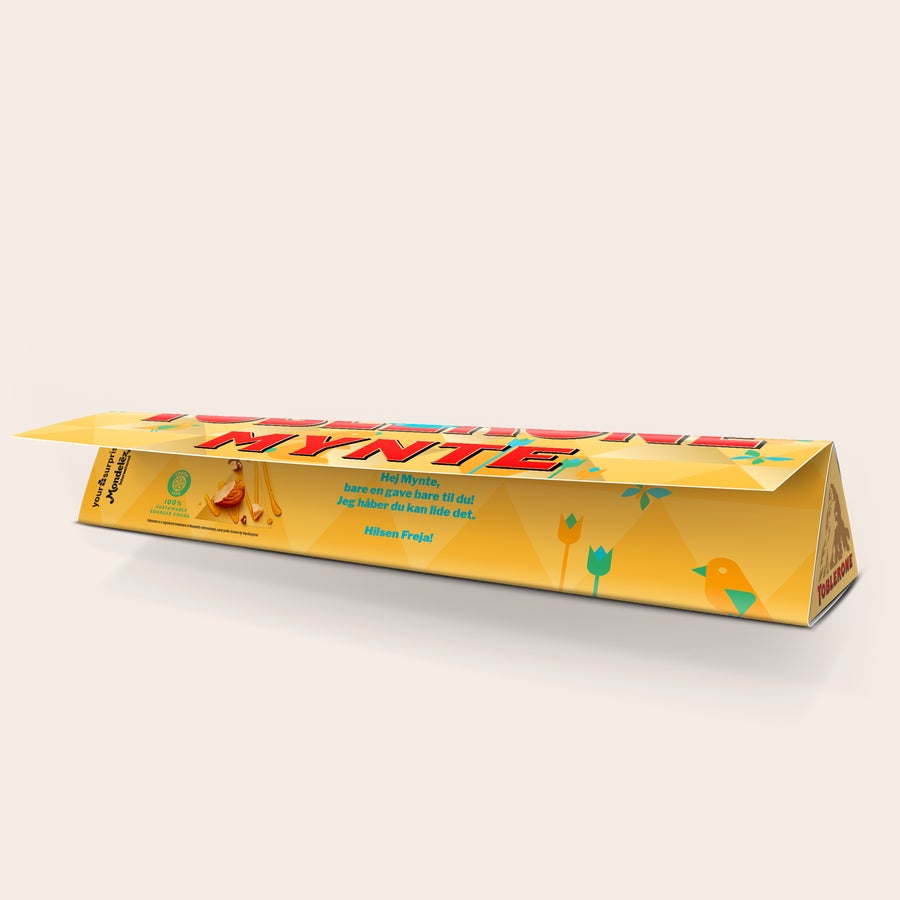 Toblerone chokolade med navn - Påske Personlig Toblerone i Påske design med navnet Mynte og hilsen fra Freja, trykt med Påskemotiver