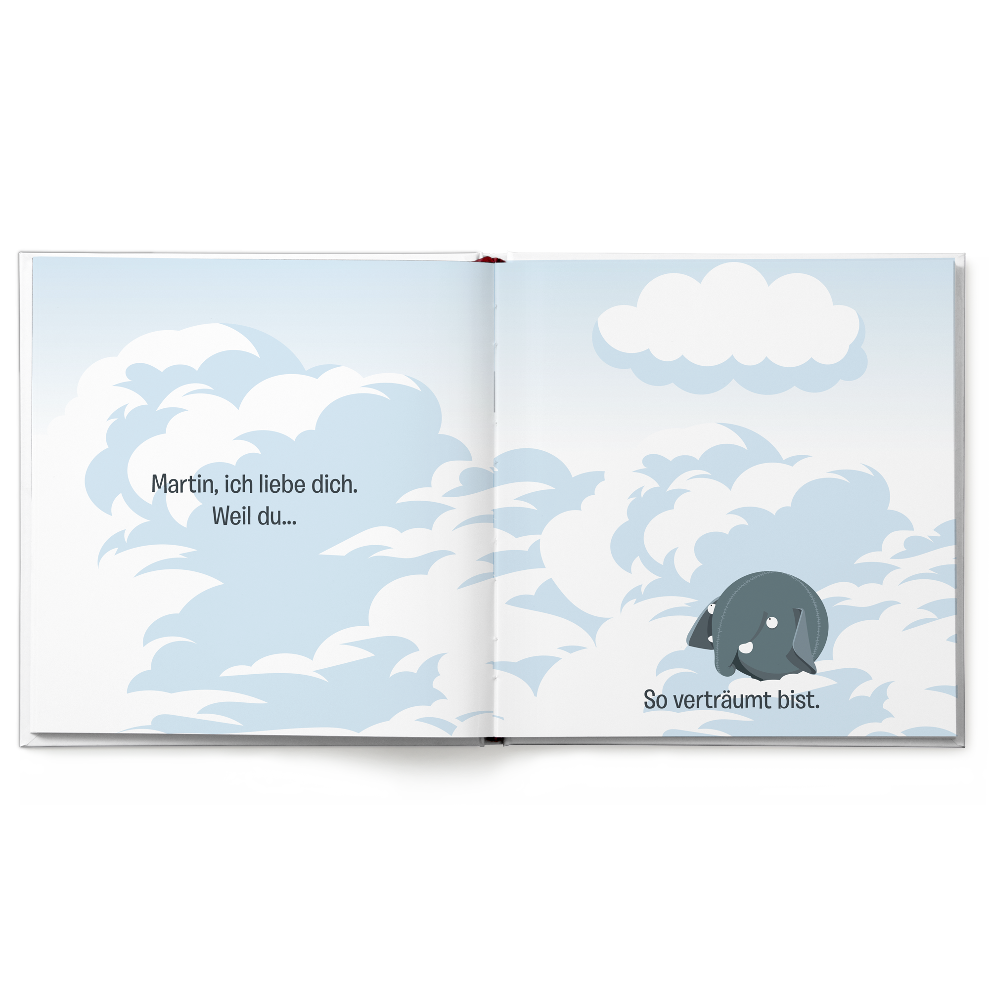 Geöffnetes personalisiertes Ollimania-Buch mit dem Namen "Martin" und dem Text "Martin, ich liebe dich. So verträumt bist." auf den Seiten.