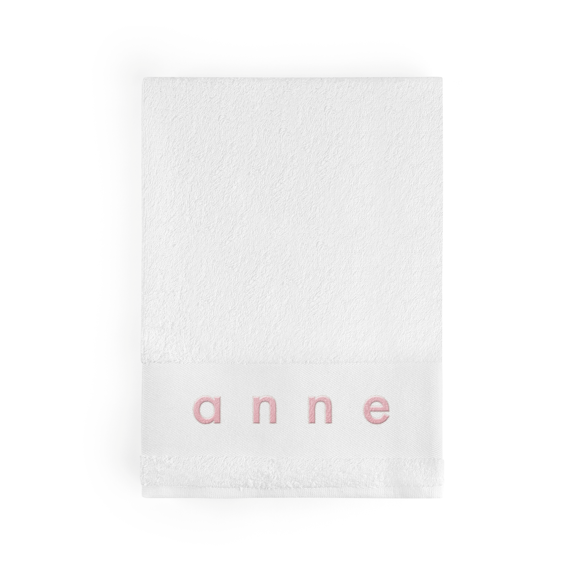 Weißes Badetuch mit dem Namen ANNE in Rosé aufgestickt, um ein personalisiertes weißes Badetuch zu schaffen