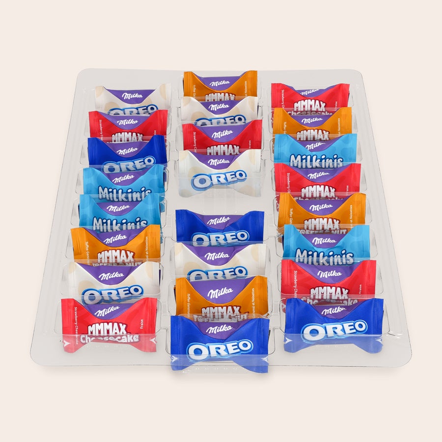 Milka Favourites Adventskalender 2025 Eine Schale mit verschiedenen Milka Schokoladen Mini-Riegeln, perfekt für einen personalisierten Adventskalender. Zähl bis Weihnachten runter mit diesem personalisierten Adventskalender.