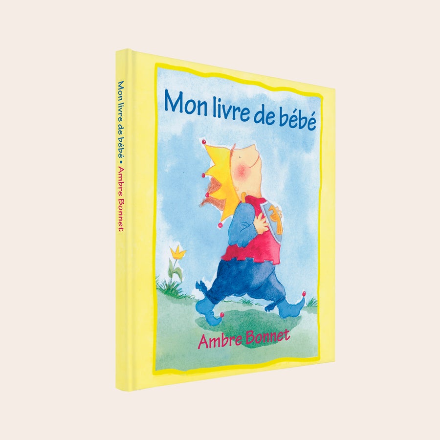 Mon livre de bébé - Livre personnalisé Livre pour bébé personnalisé avec le texte Mon livre de bébé Ambre Bonnet et un personnage enfant déguisé en roi