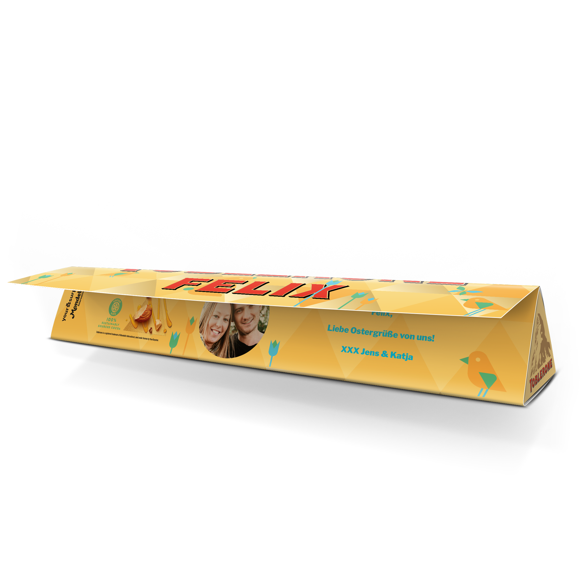 Personalisierte Toblerone Schokolade mit dem Namen Felix und einem Foto von Jens und Katja, bedruckt mit dem Text "Liebe Ostergrüße von uns!".