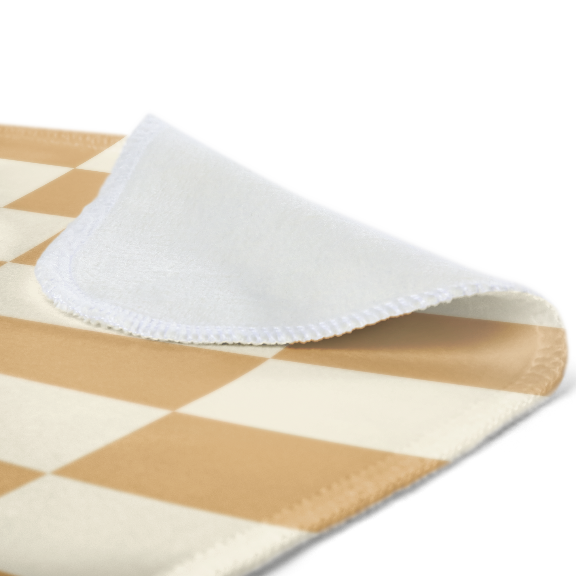 Close-up of a cozy fleece photo blanket featuring a beige and cream checkerboard pattern
