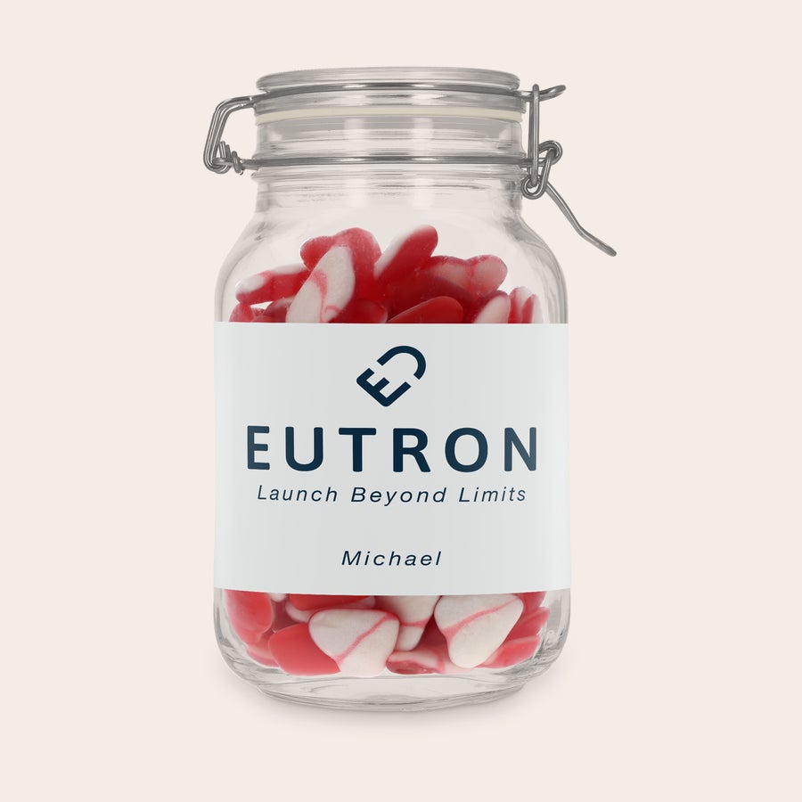 Personalisierte Bonbonglas Personalisiertes Bonbonglas mit Herzen, bedruckt mit dem Logo "EUTRON Launch Beyond Limits" und dem Namen Michael