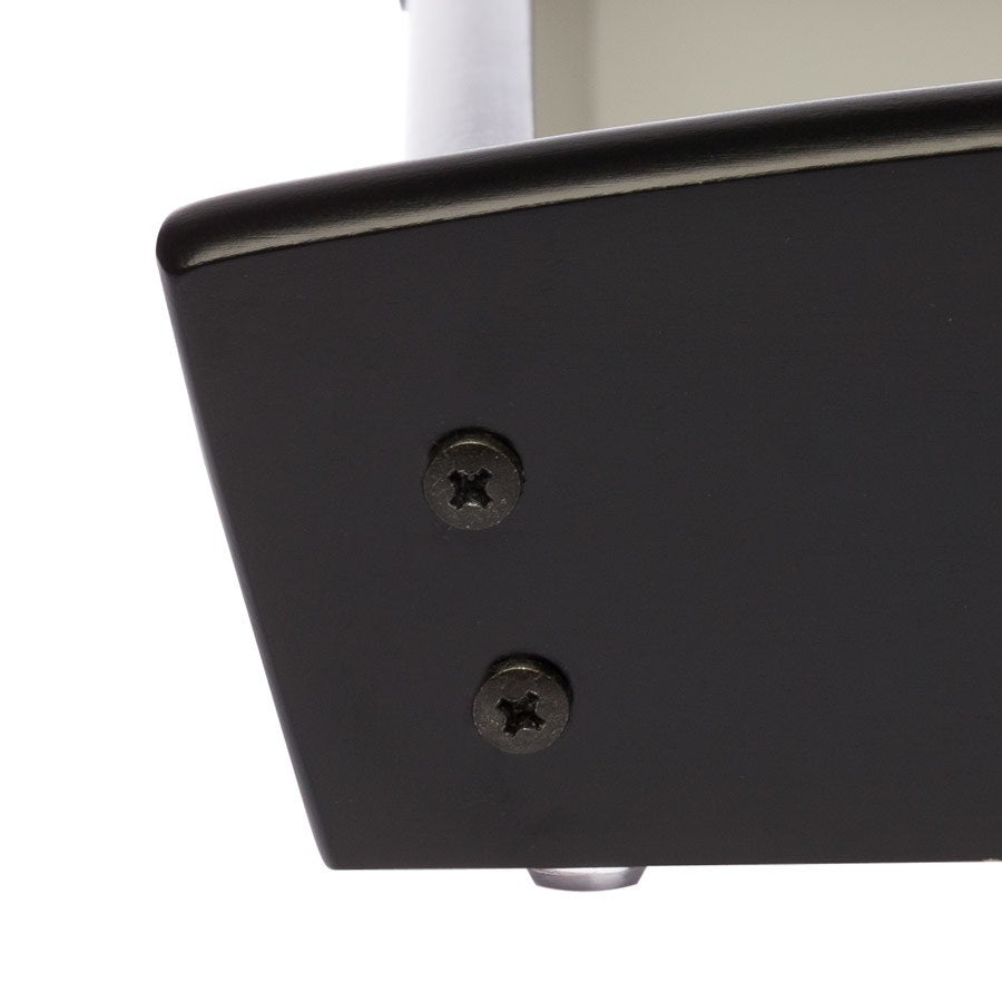 Close up of the sturdy black wooden frame of a custom serving tray with screws