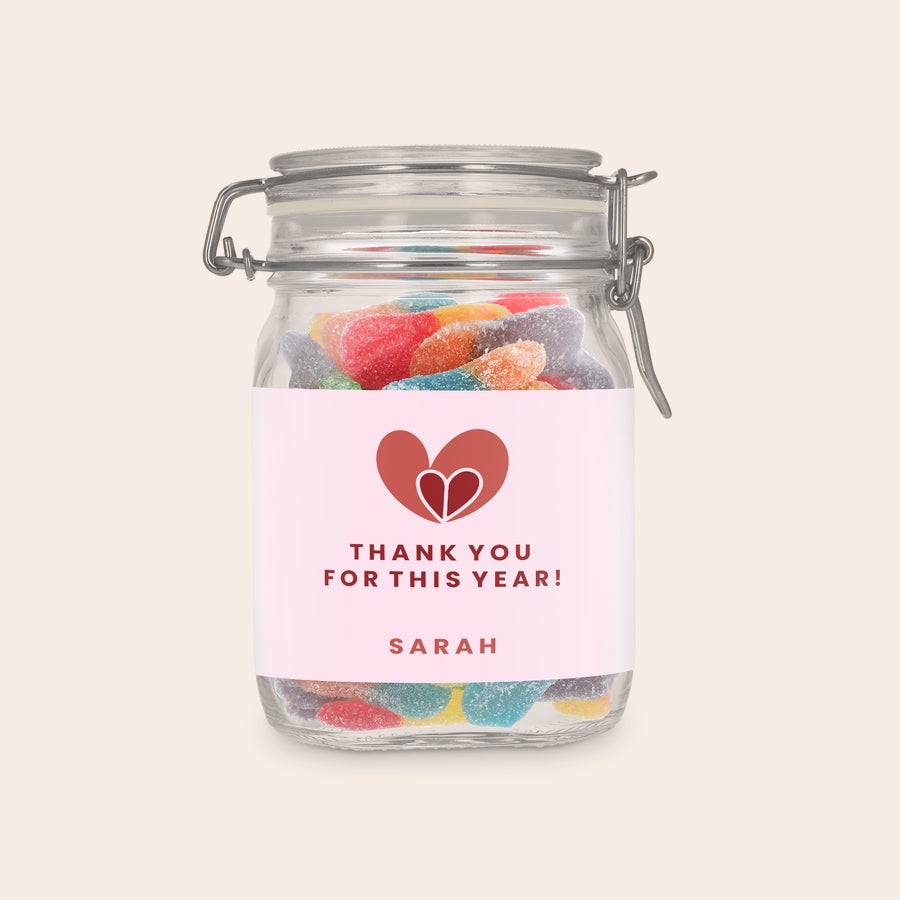 Personalised sweet jar Personalised sweet jar with sour sticks, printed with a pink label with a heart graphic, Thank You For This Year message, and the name Sarah