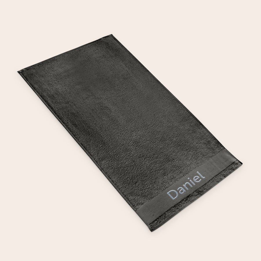 Asciugamano da bagno con testo Asciugamano antracite personalizzato con nome Daniel ricamato in celeste un regalo unico