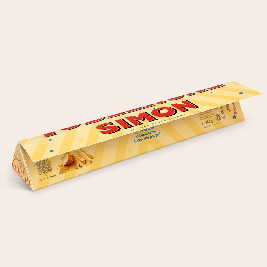 Personliga Toblerone - Farsdag En personaliserad Toblerone med Simon tryckt på omslaget och texten Till den bästa pappan, Älskar dig pappa!