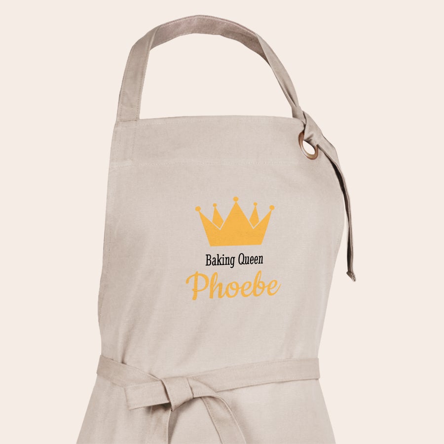 Apron Beige personalized apron printed with a crown and the name Phoebe, a unique personalised apron design