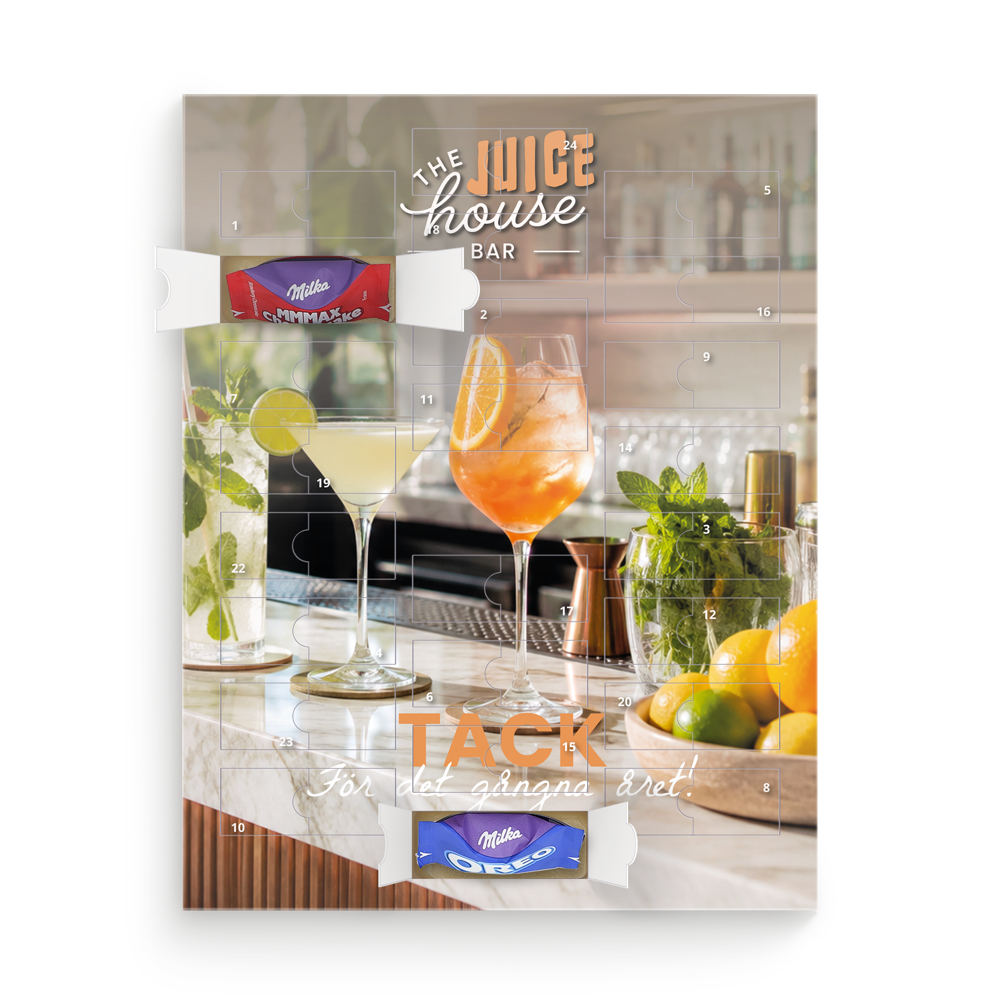 En Milka Favourites adventskalender med en personlig bild av en bar tryckt på framsidan, med texten "The Juice House Bar" och "Tack för det gångna året!" synlig.