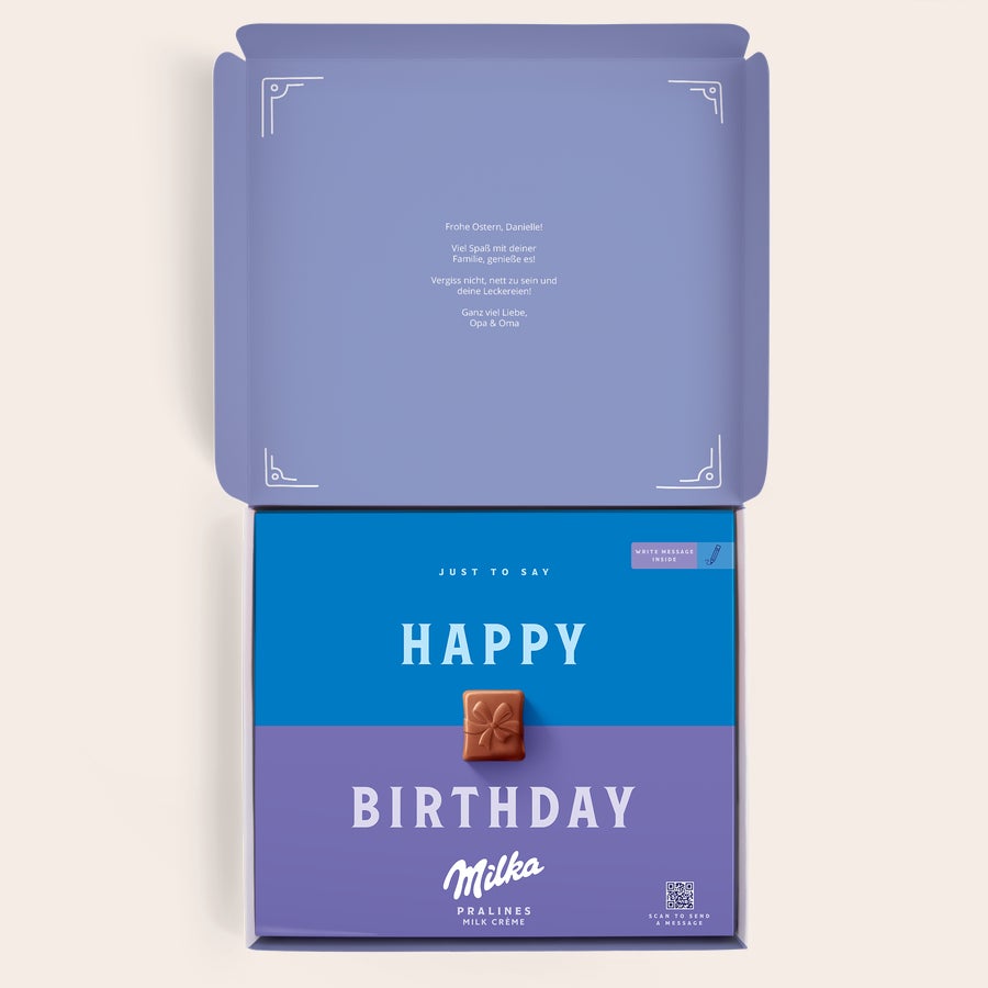 Milka Pralinen Ostern Personalisierte Milka Geschenkbox mit Aufdruck "Frohe Ostern, Danielle! Ganz viel Liebe, Opa & Oma" im Deckel.