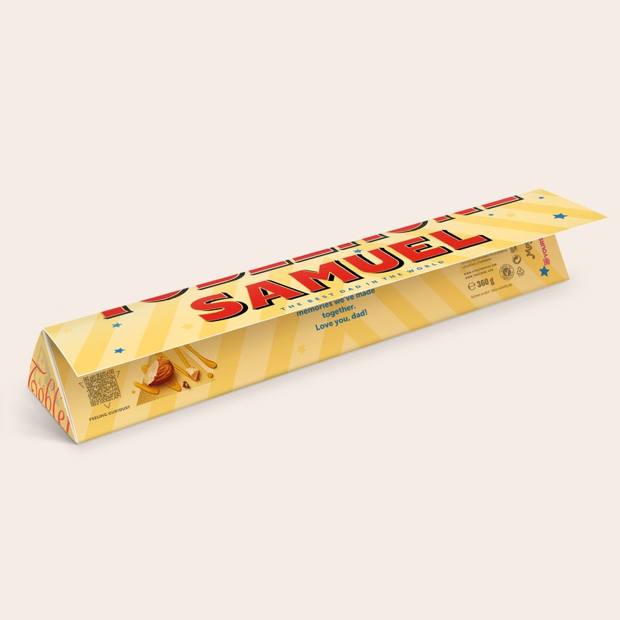Toblerone - Apák napja Egyedi Toblerone csokoládé "SAMUEL THE BEST DAD IN THE WORLD" felirattal, nyomtatott személyes üzenettel apák napjára.