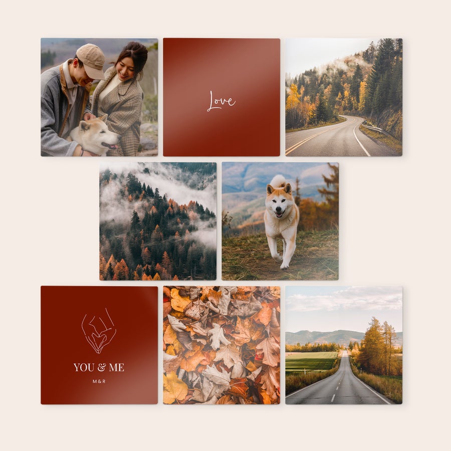 Personalised wall art panels Seven square wooden wall art panels with custom designs, including photos of a couple, a dog, and autumn landscapes, alongside panels printed with the words Love and You & Me.