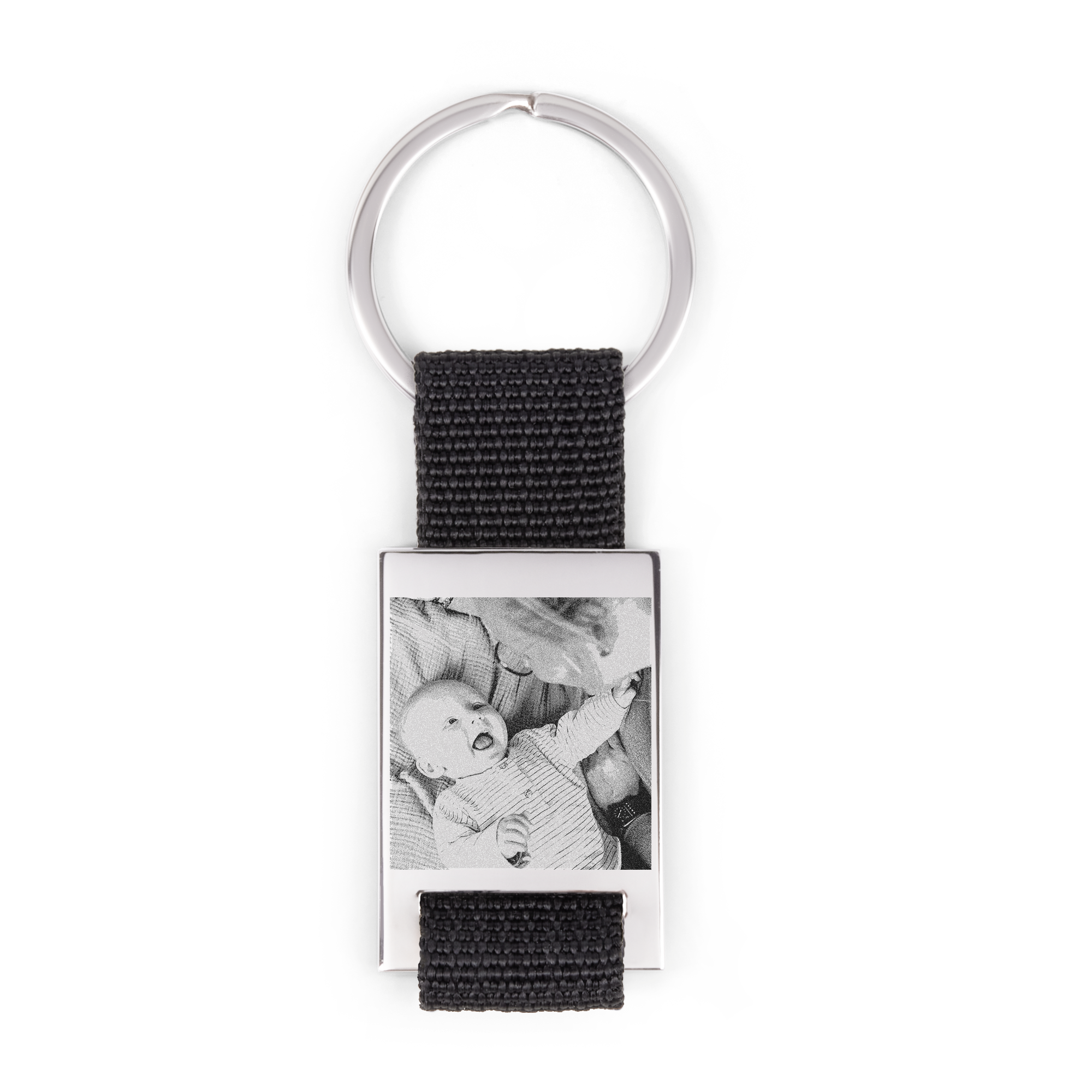 Zilverkleurige sleutelhanger met foto van een baby, gegraveerd in metaal voor een persoonlijke touch.
