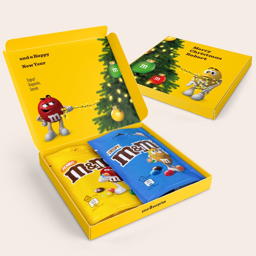 Personalizirana darilna škatla M&M's Personalizirana darilna škatla s čokolado M&M's, potiskana z božičnim drevescem, imenom in sporočilom.