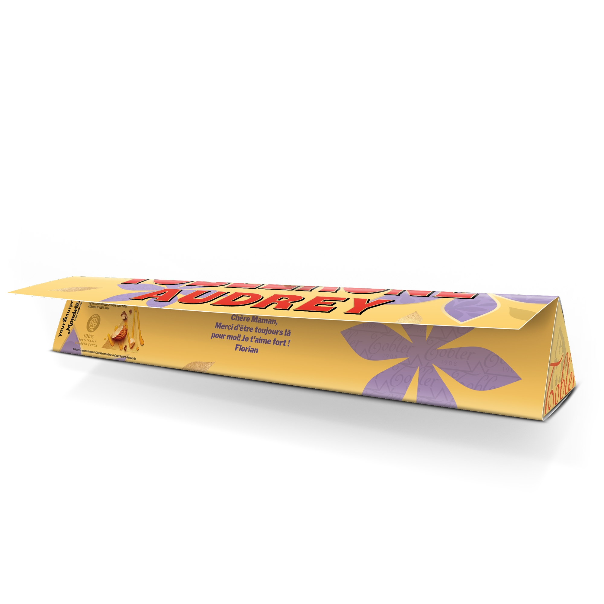 Barre de chocolat Toblerone personnalisée avec le nom Audrey et un message spécial imprimés. Surprenez votre maman.