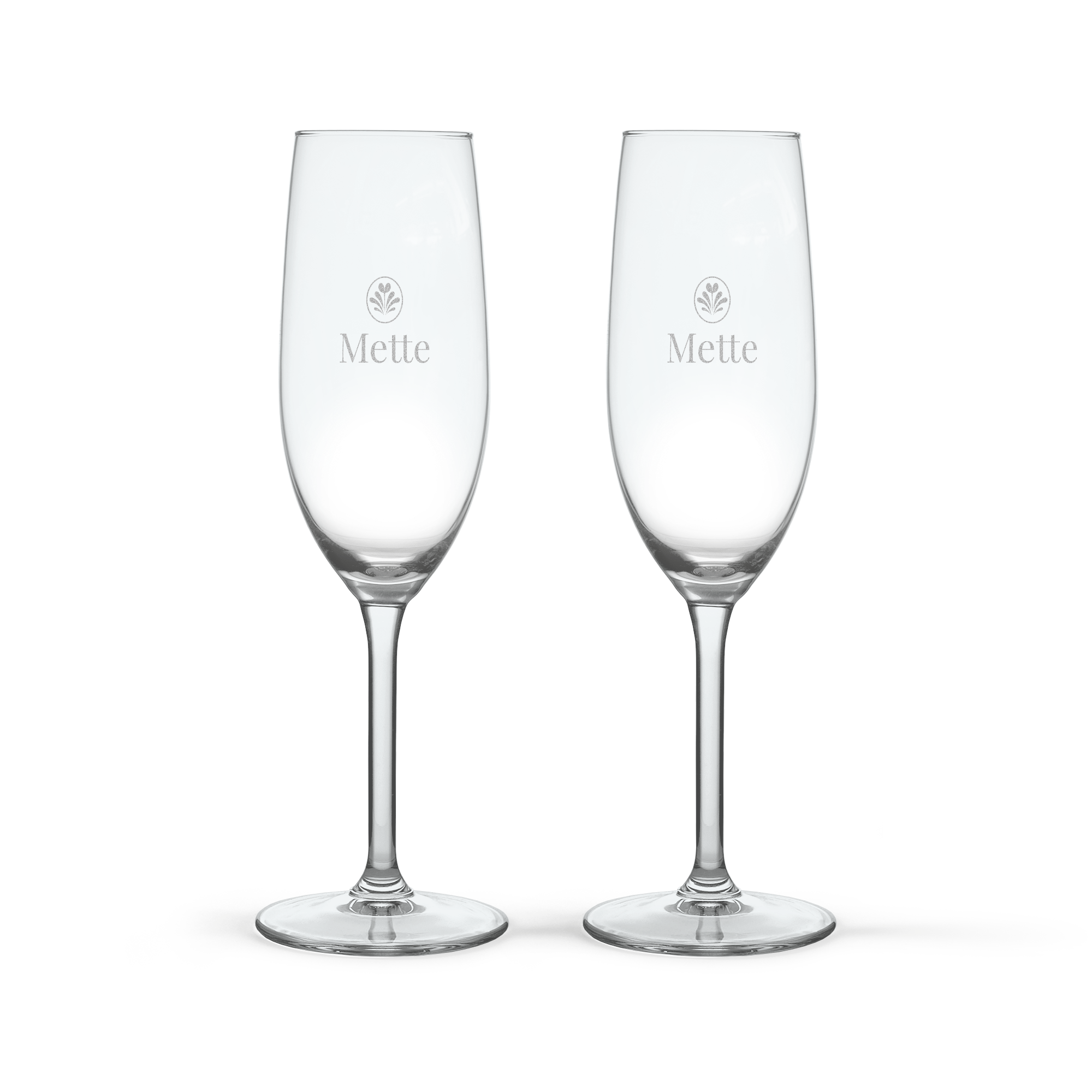 To champagneglas med gravering af navnet "Mette" og et design, perfekt til en festlig anledning.