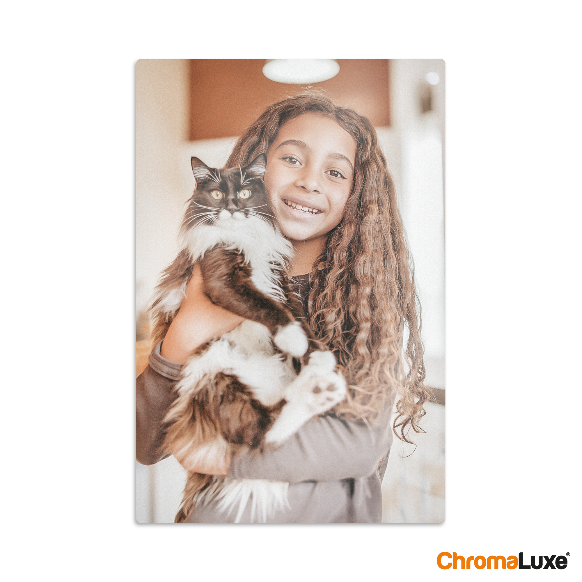 Chromaluxe aluminium photo print of a smiling girl holding a black and white cat, custom printed from your favorite memories