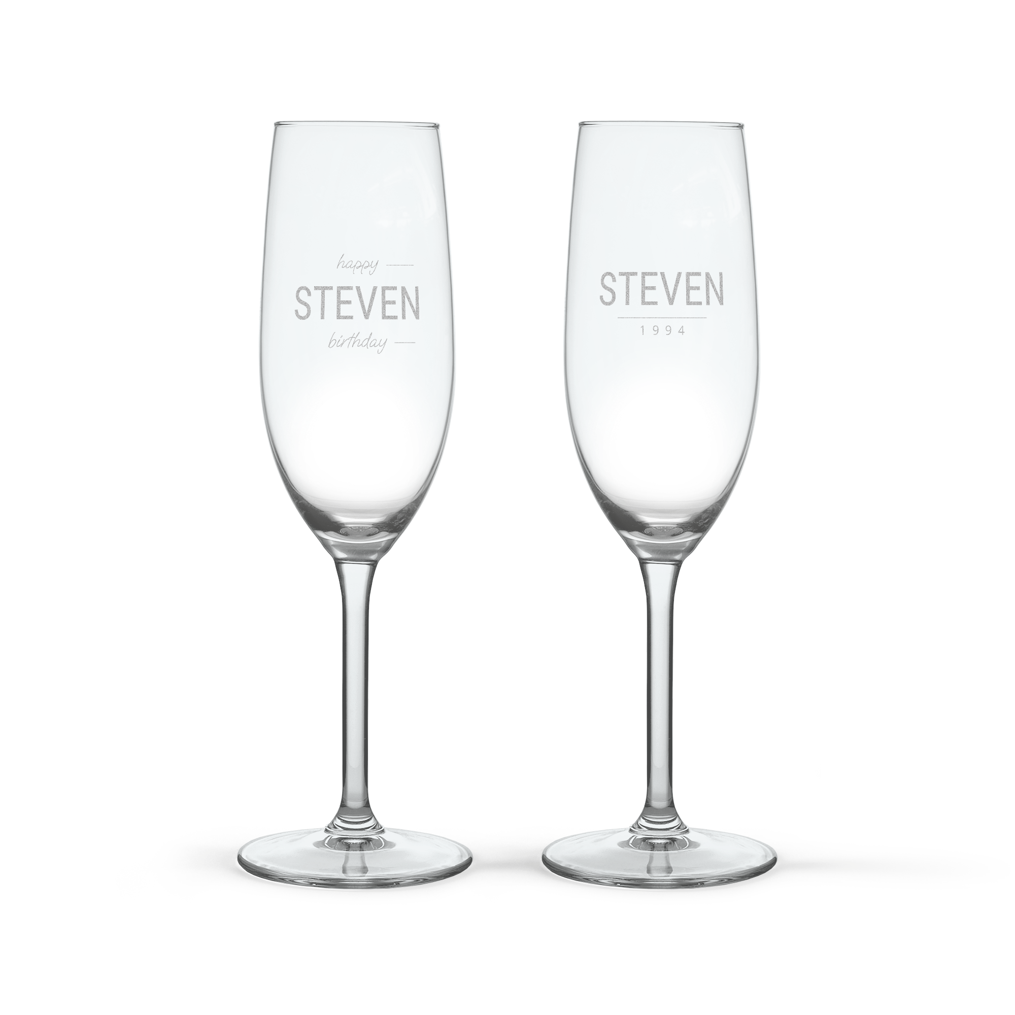 Two personalised champagne glasses, engraved with the name Steven and special dates, ready for a toast.