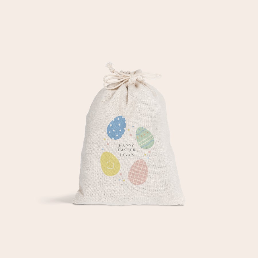 Drawstring gift bag - Easter Personalised drawstring gift bag for Easter, printed with colorful egg designs and the name Tyler