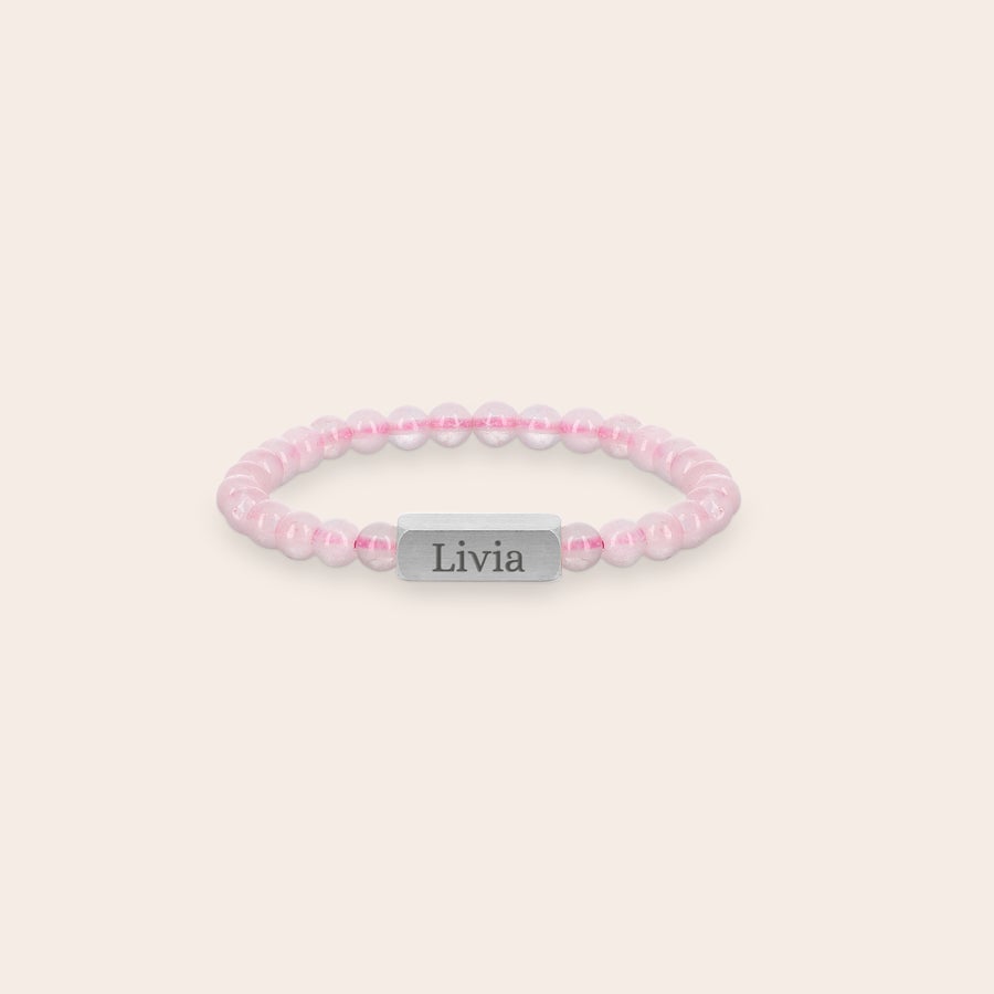 Rose quartz bracelet for children - engraved Personalized rose quartz engraved bracelet for children, size XS with 4mm beads and a silver bar engraved with the name Livia.
