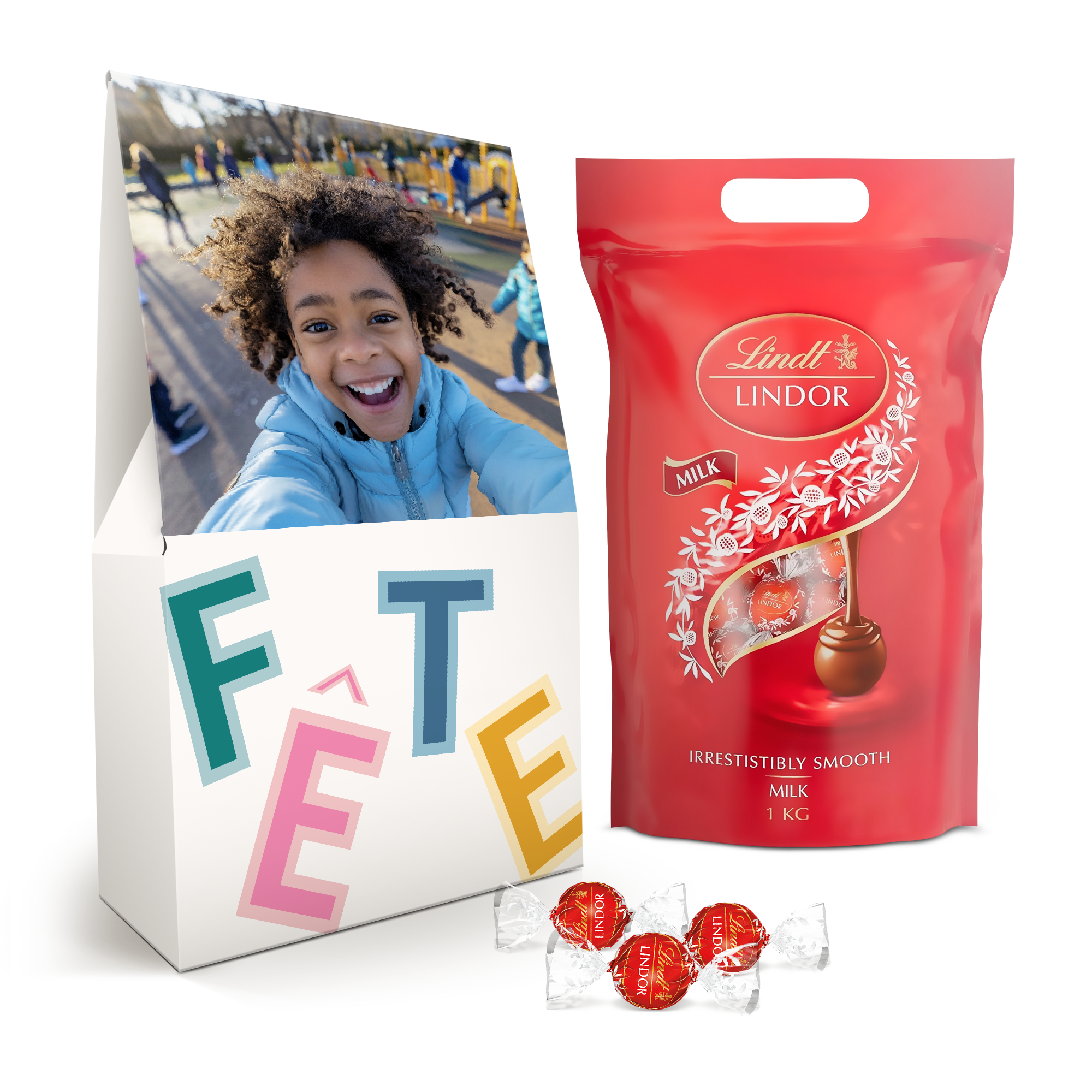 Boîte cadeau personnalisée avec une photo dun enfant souriant et un texte Fête. Contient 1 kg de délicieux chocolat Lindor.