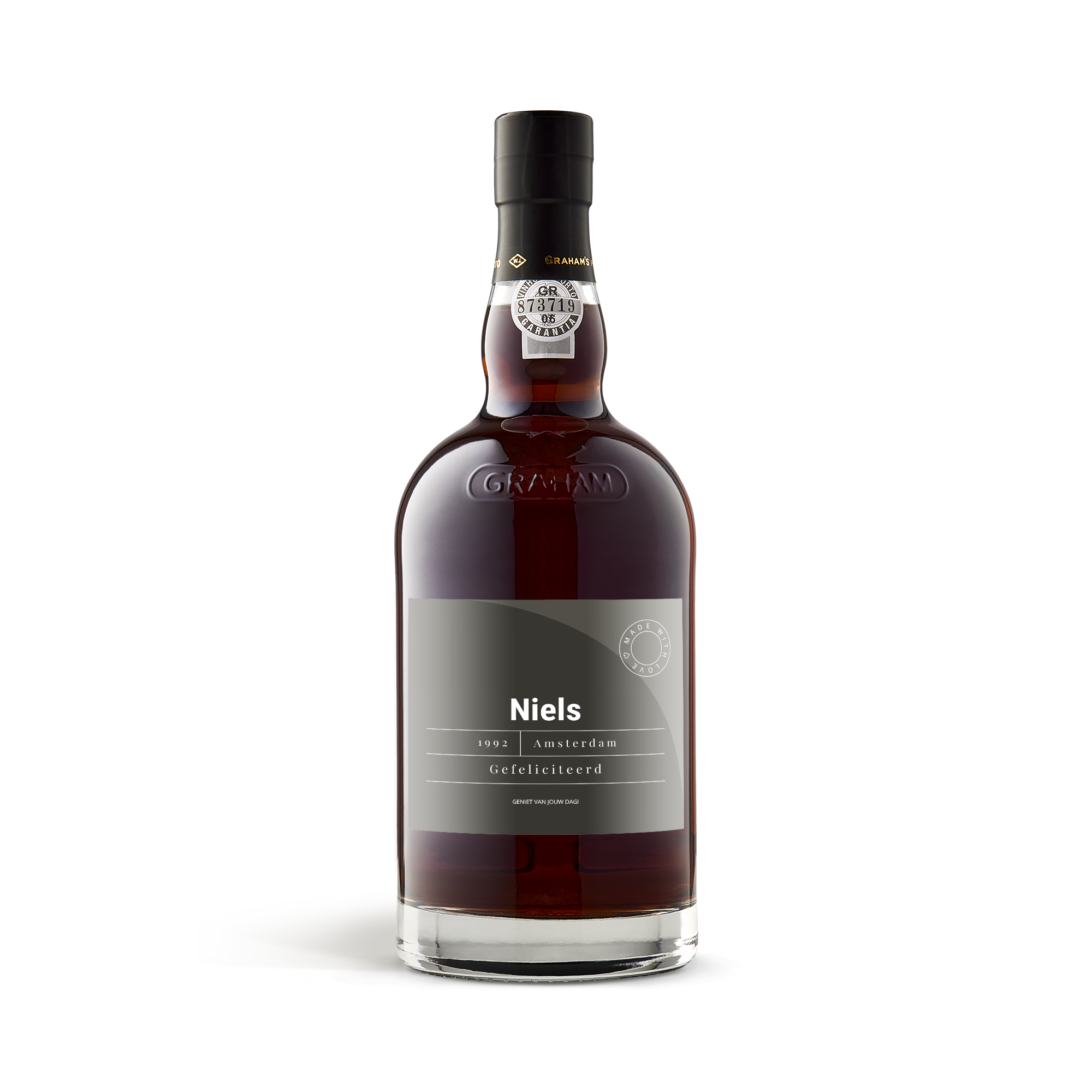 Fles port met een persoonlijk etiket, bedrukt met de naam Niels, het jaartal 1992, en de tekst Gefeliciteerd.