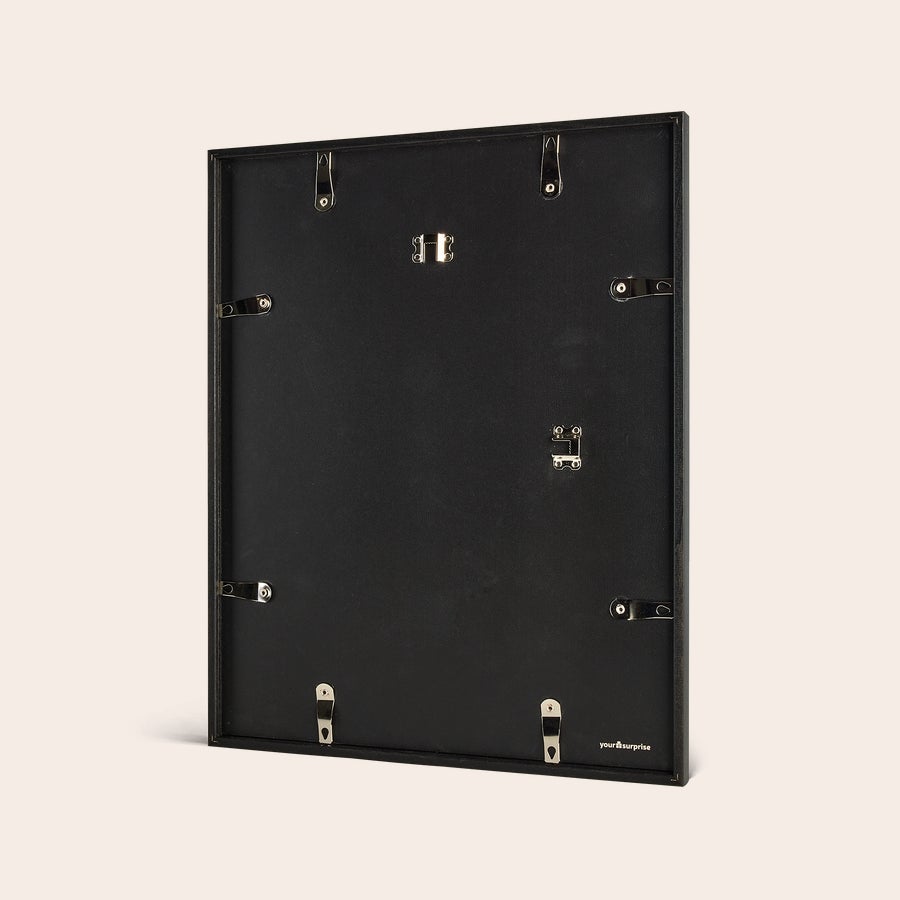 Personalised photo print with frame Back of a black wooden frame for a personalized photo print to hang on your wall.