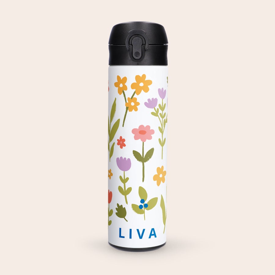 Personaliseret, luksuriøs vandflaske Hvid luksus vandflaske med navn Liva og blomstermønster, trykt med navn og billede.