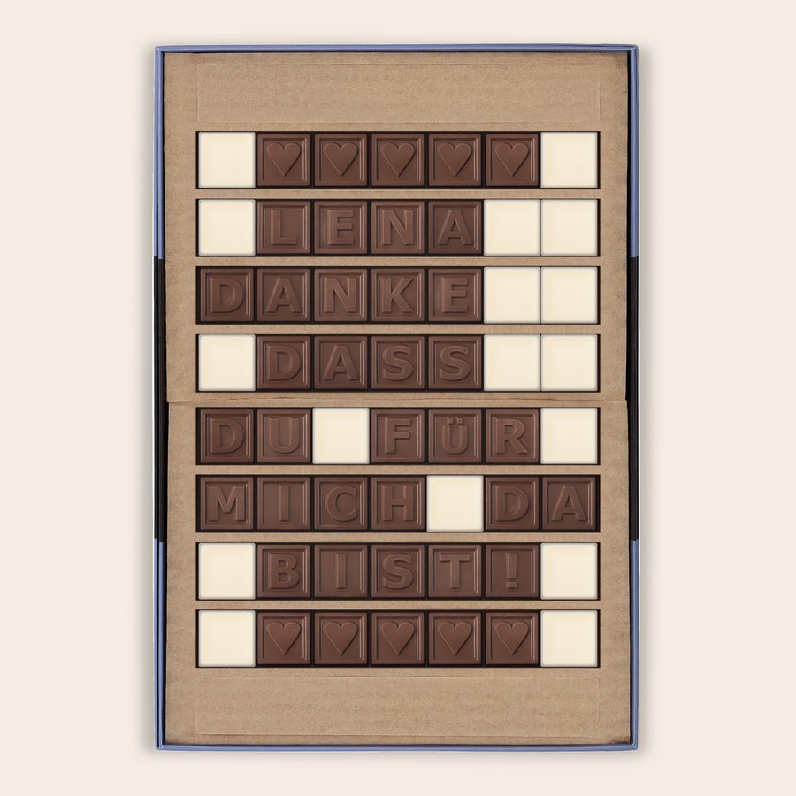 Schokotelegramm Selber Gestalten Personalisiertes Schokoladentelegramm mit der Nachricht "LENA DANKE DASS DU FÜR MICH DA BIST" aus Milchschokolade und Herzen, weiß gedruckt, in einer Geschenkbox. Genieße ein persönliches Schokoladentelegramm mit deiner persönlichen Nachricht.