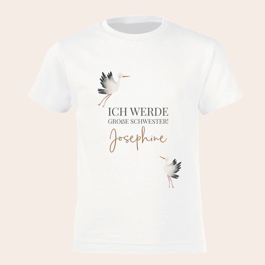 T-Shirt bedrucken - großer Bruder/große Schwester Weißes Kinder-T-Shirt bedruckt mit Störchen, dem Text "ICH WERDE GROSSE SCHWESTER!" und dem Namen Josephine, ideal zur Schwangerschaftsverkündung.