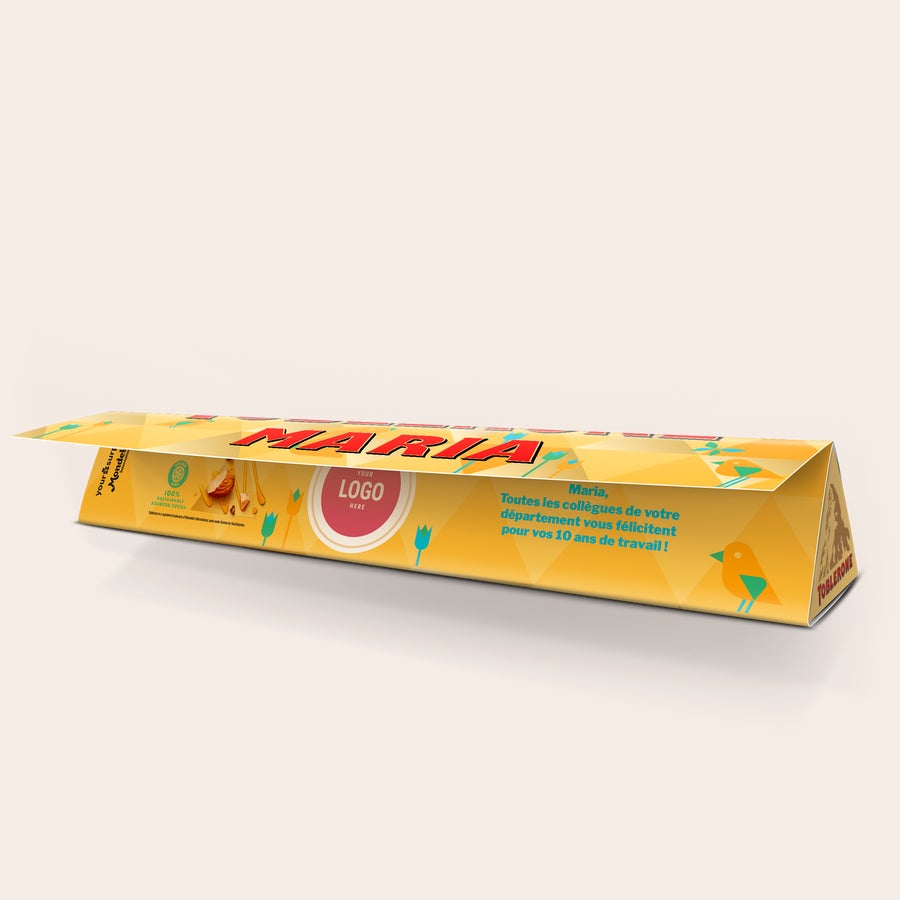 Toblerone de Pâques personnalisé Barre de Toblerone de Pâques personnalisée avec le prénom Maria et un message, imprimée avec un logo.