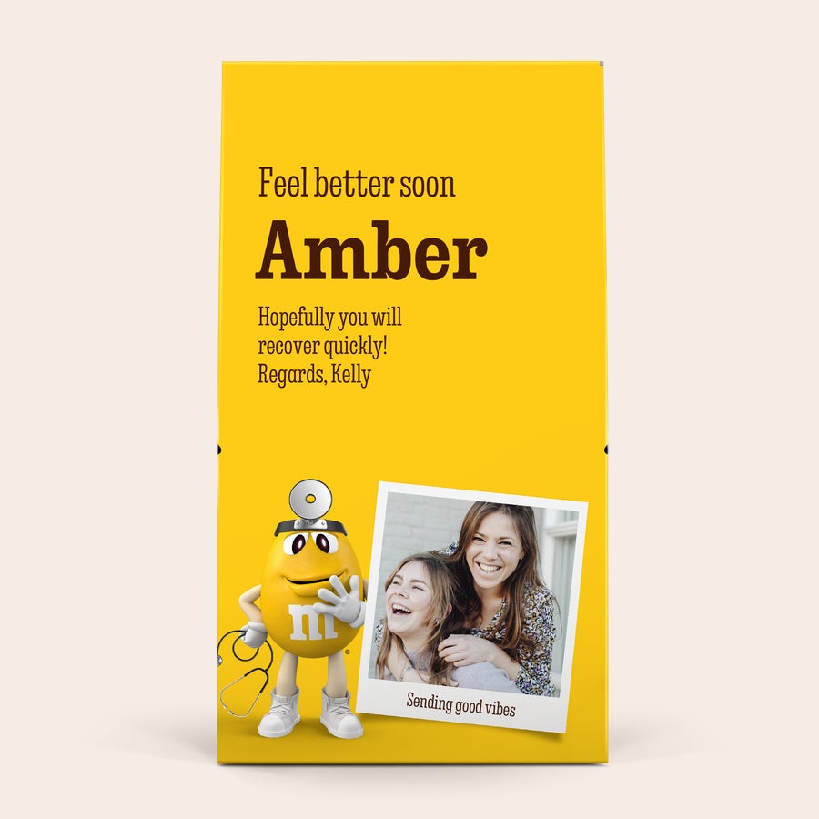 Personalised XL M&M's gift box - 6 bags (714 grams) XL M&Ms chocolate gift box with a personalized photo of two women, "Sending good vibes" text, and printed get well soon message to Amber from Kelly.