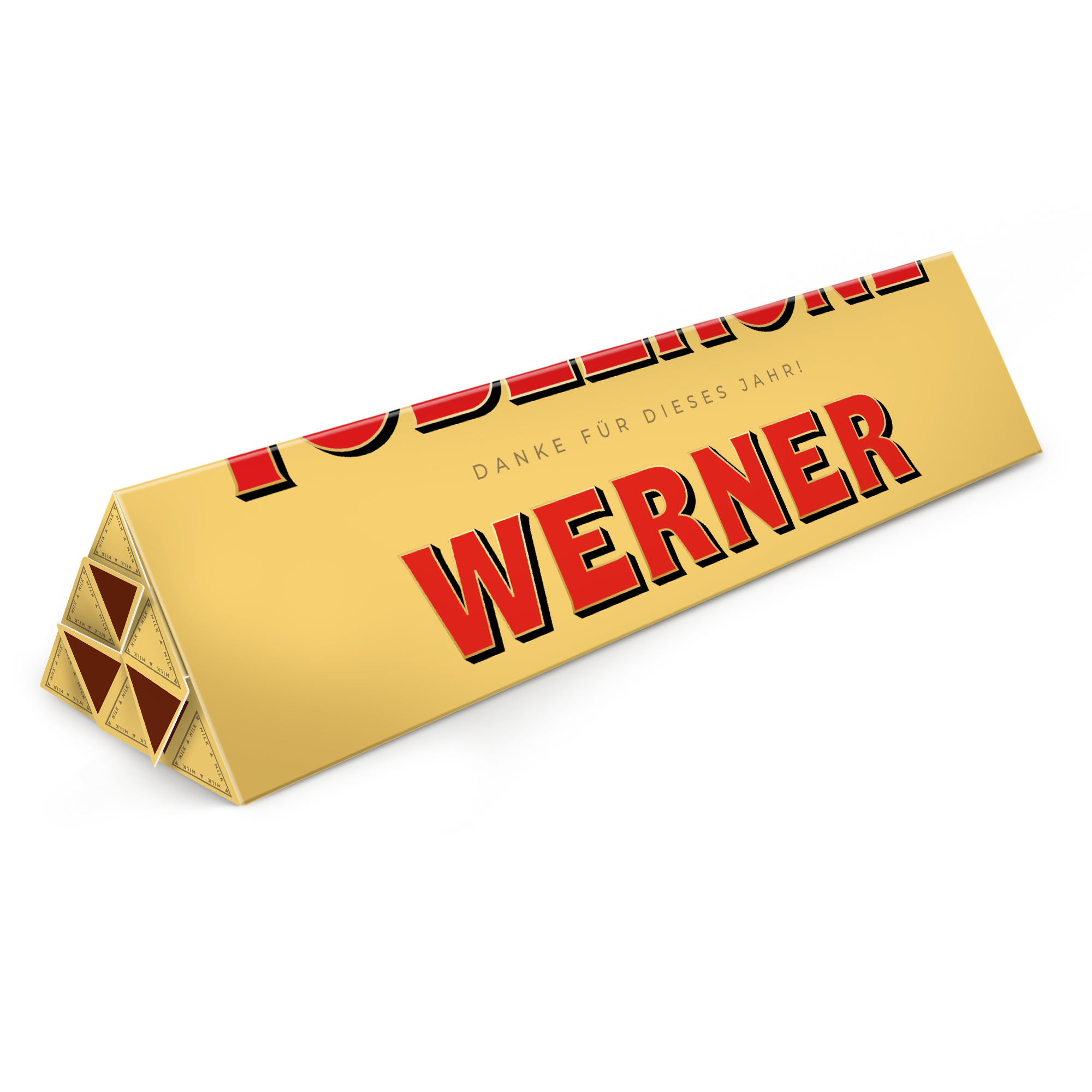 Toblerone personalisieren - 3600 Gramm: Großformatige Toblerone-Schokolade mit "DANKE FÜR DIESES JAHR! WERNER" auf goldener Verpackung.
