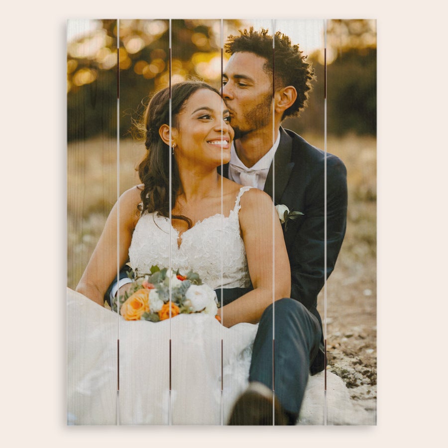 Photo on wood Photo printed onto wooden planks showing a couple in wedding attire. The photo is customized with the couples image.