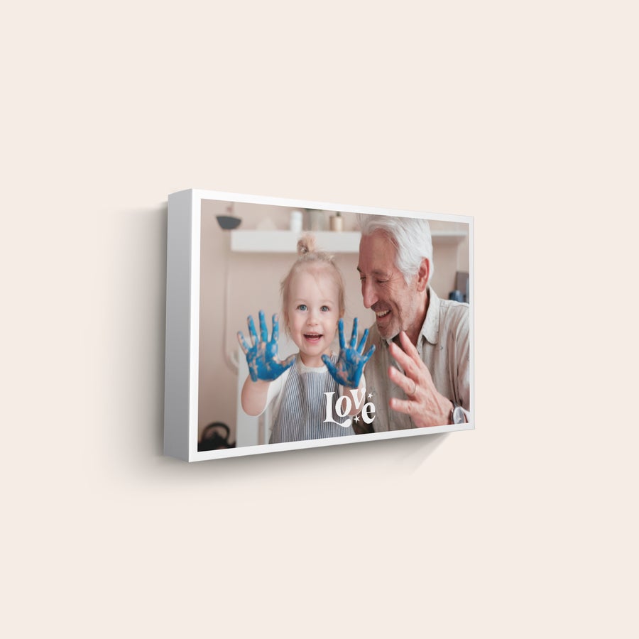 Personalised photo canvas Personalized photo canvas with a printed image of a child and an adult, emphasizing "Love" text.