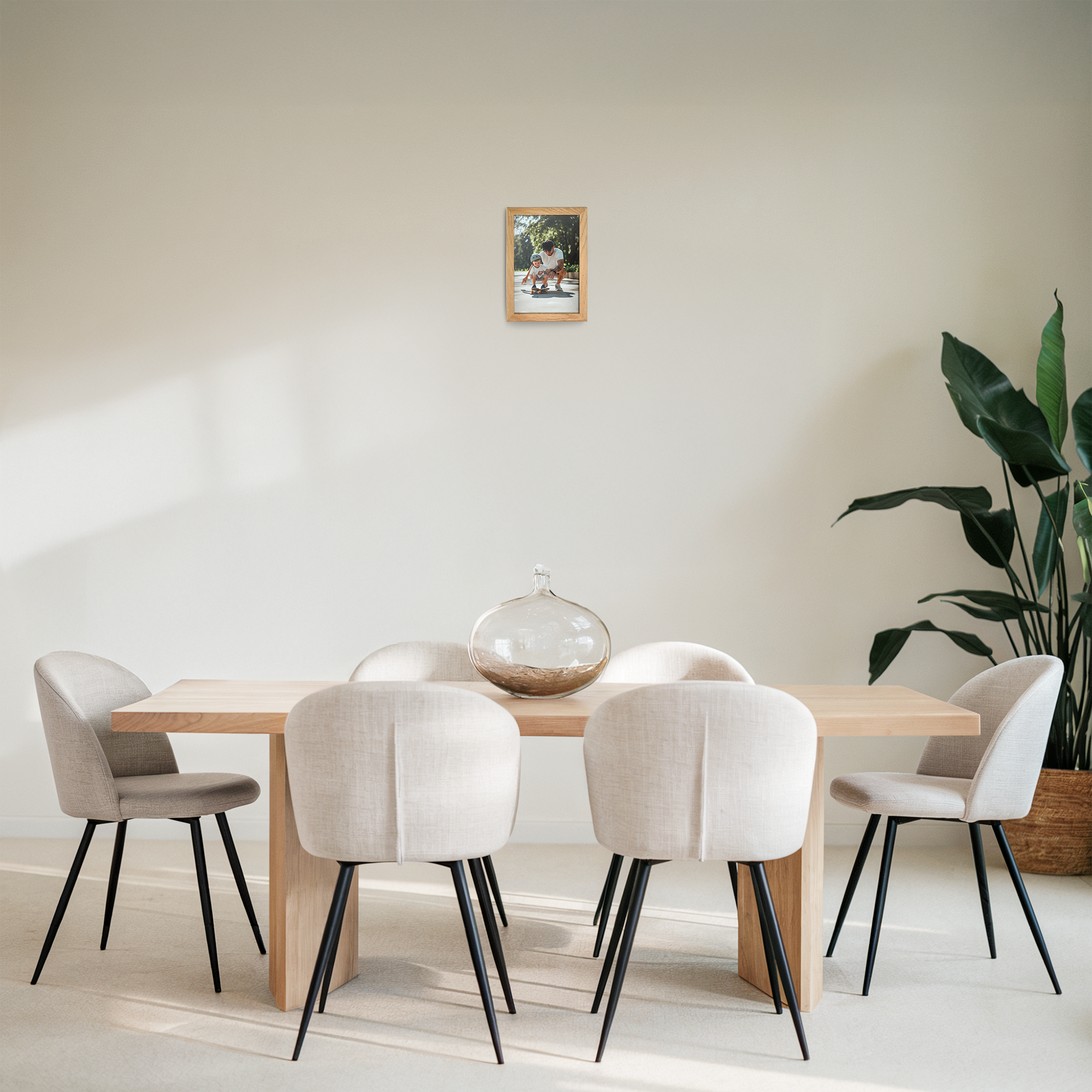 A personalized photo print in a light brown wooden frame hanging on a wall in a dining room