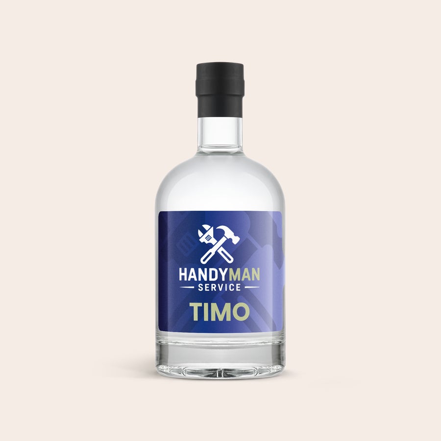 Personalizovaná YourSurprise vodka Lahodná láhev vodky s personalizovaným štítkem Handyman Service Timo, potištěná obrázkem nářadí.