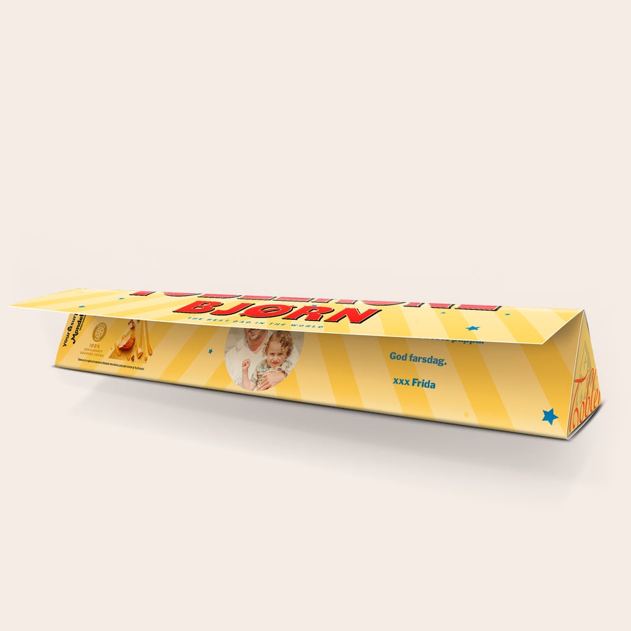 Personlig Toblerone - Farsdag Personlig Toblerone-sjokolade med bilde av far og barn, trykket tekst God farsdag og navnet Frida.