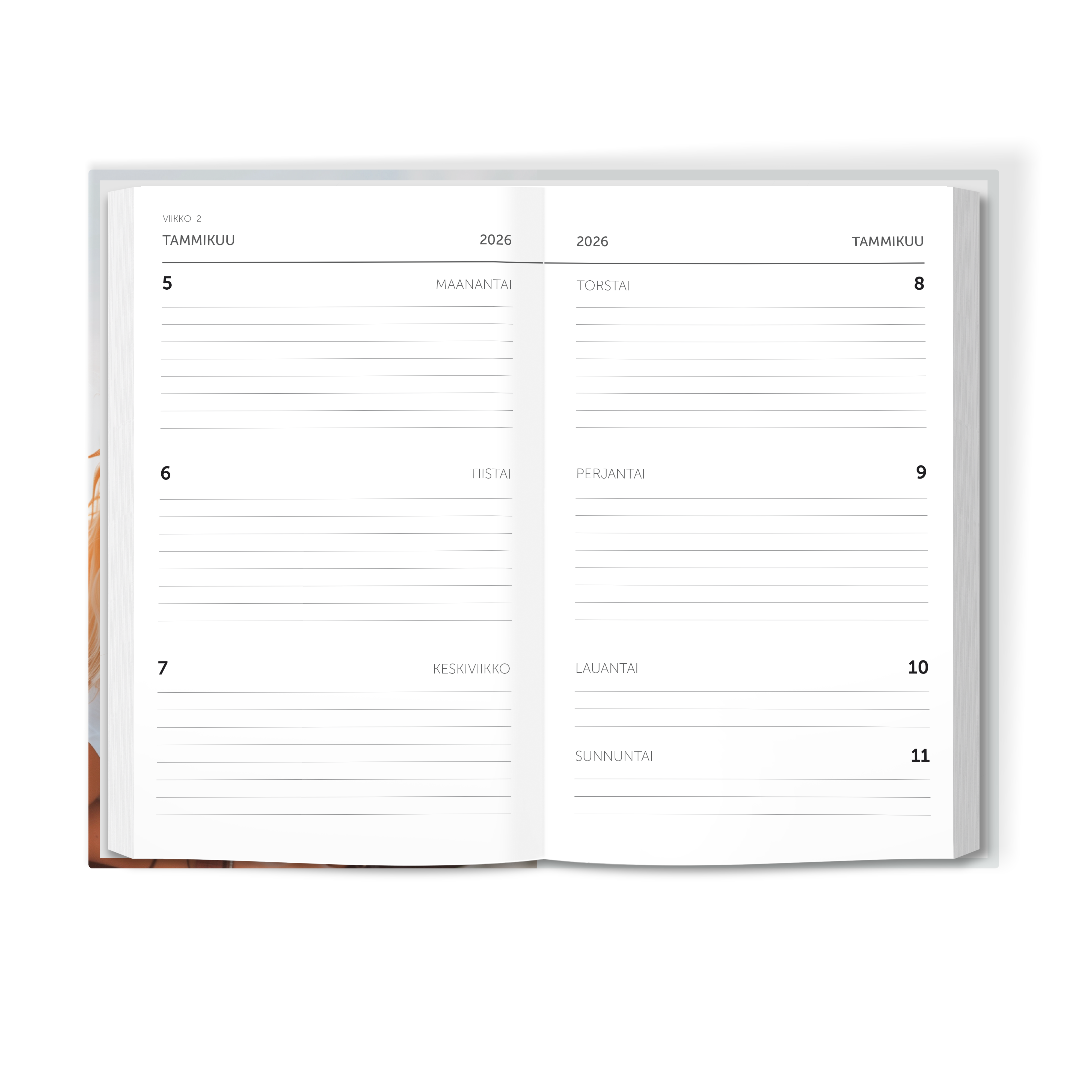 Auki oleva yksilöllinen päiväkirja, jossa näkyvät tammikuun 2026 päivät 5-11 ja tekstit "MAANANTAI" "TIISTAI" "KESKIVIIKKO" "TORSTAI" "PERJANTAI" "LAUANTAI" ja "SUNNUNTAI".