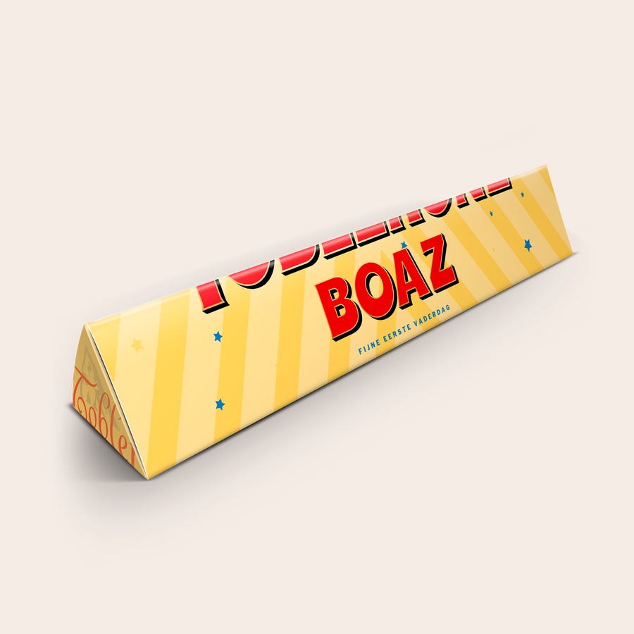 Toblerone Vaderdag met naam Gepersonaliseerde Toblerone chocoladereep met de naam Boaz en tekst "Fijne eerste Vaderdag" geprint op de wikkel. Verras je liefste papa met een persoonlijke Toblerone chocoladereep.