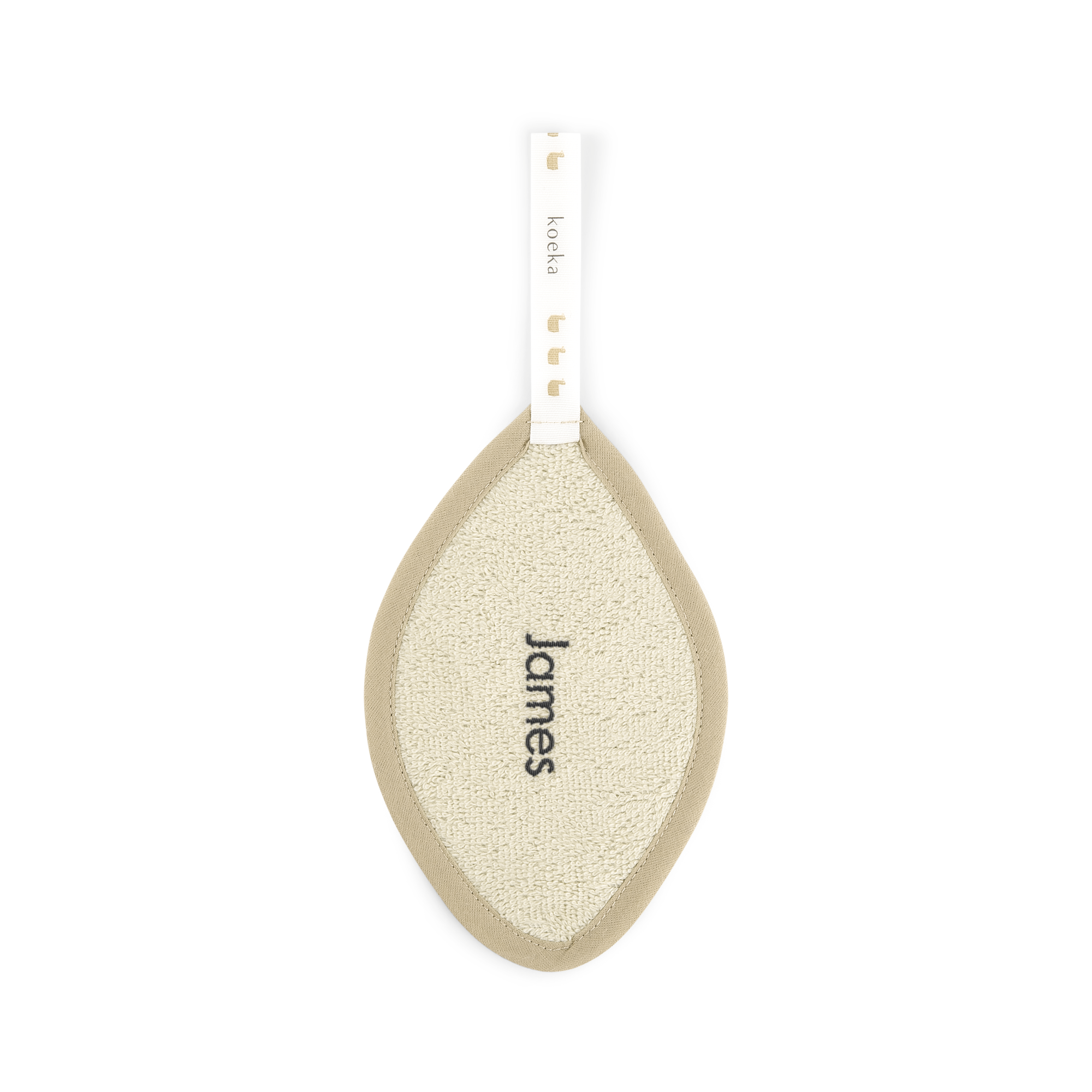 Paño sostenedor de chupete Koeka color beige con el nombre "James" bordado en negro.