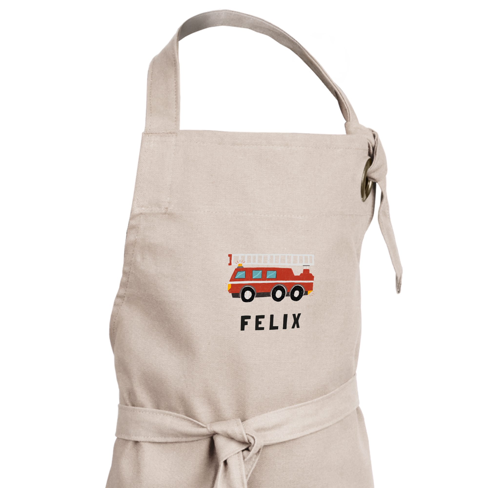 Beige Kinderschürze mit rotem Feuerwehrauto-Aufdruck und dem Namen Felix, personalisiert bedruckt