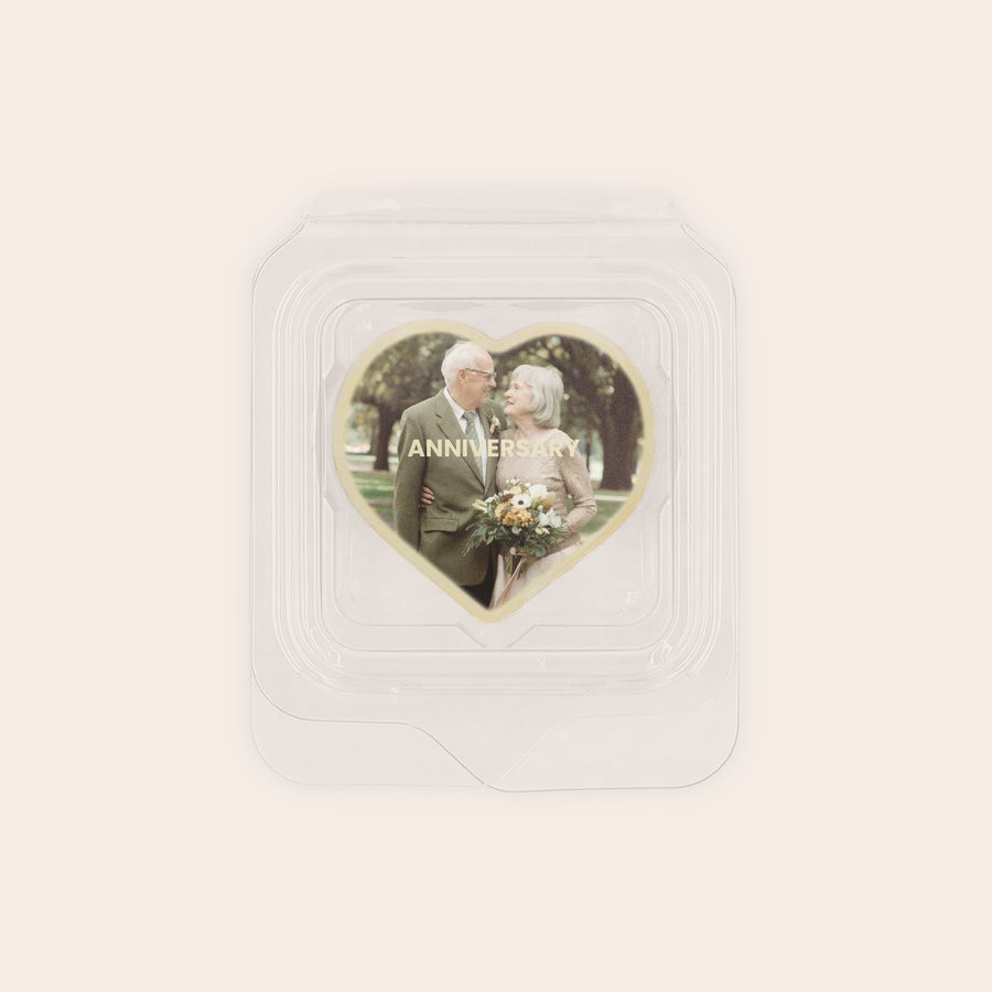 Personalised photo chocolates - Individually wrapped Heart-shaped praline favor printed with an anniversary photo of a couple for delicious praline favors.
