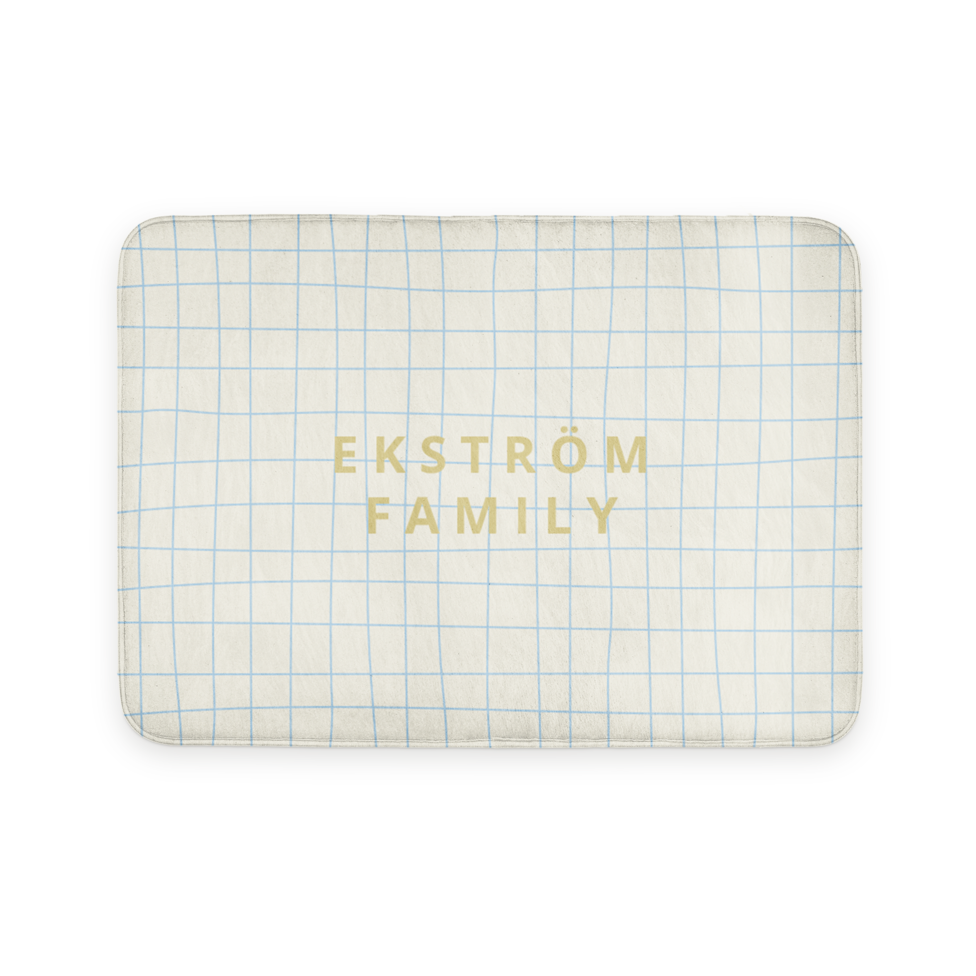 Personlig badrumsmatta med ett blårutigt mönster och texten "EKSTRÖM FAMILY" tryckt i guld.